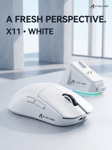 White ATTACK SHARK X11 gaming mouse beside its RGB charging dock