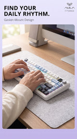 Hands typing on a white and blue AULA F75 MAX gasket-mount keyboard
