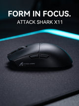 Black ATTACK SHARK X11 wireless gaming mouse on a dark desk mat